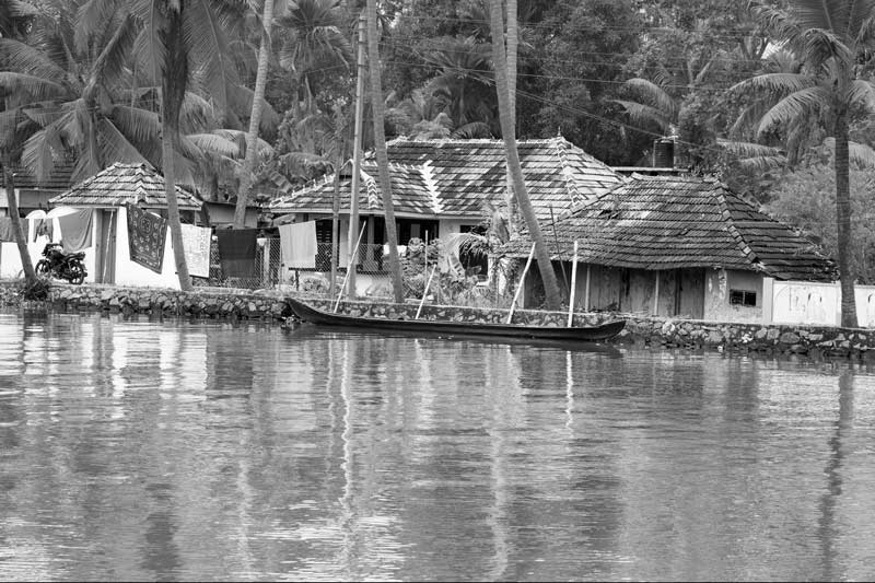 Living Below the Sea Level - cluster of houses along an embankment in Alappuzha district, Kerala